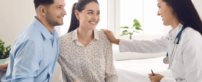 Happy couple with a doctor