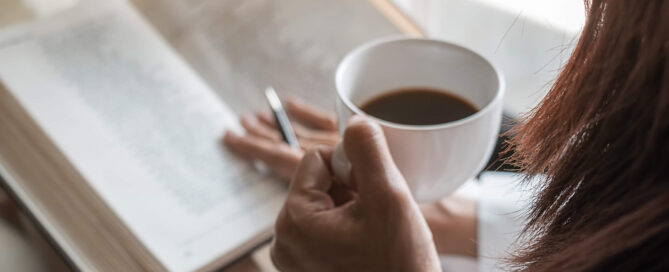 Woman Reading a book with coffee